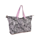 A large tote bag with a black and white zebra print pattern and light pink handles, shown on a plain white background.