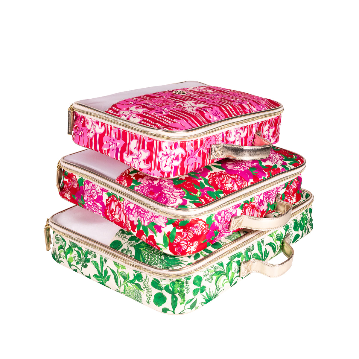 Three stacked rectangular cosmetic cases with floral prints in pink, red, and green, featuring gold-tone metal handles and zippers, on a white background.