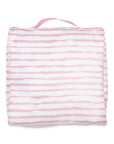 pink and white striped packing cube on a white background