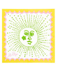 Decorative square with a face design in green on a yellow background, featuring the brand 'Lilly Pulitzer'.