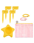 Set of yellow and pink pet accessories including a star-shaped bowl, pink pouch, and hair ties on a white background.