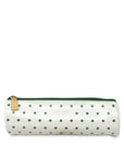 White cylindrical pouch with green polka dots and a gold zipper on a white background