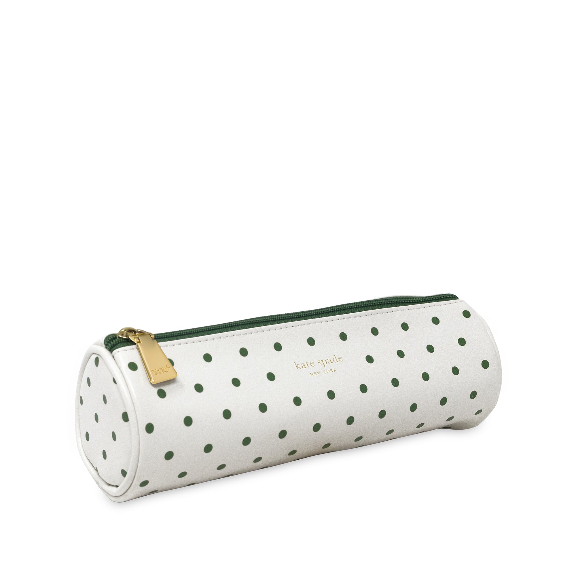 White cylindrical pouch with green polka dots and a gold zipper on a white background