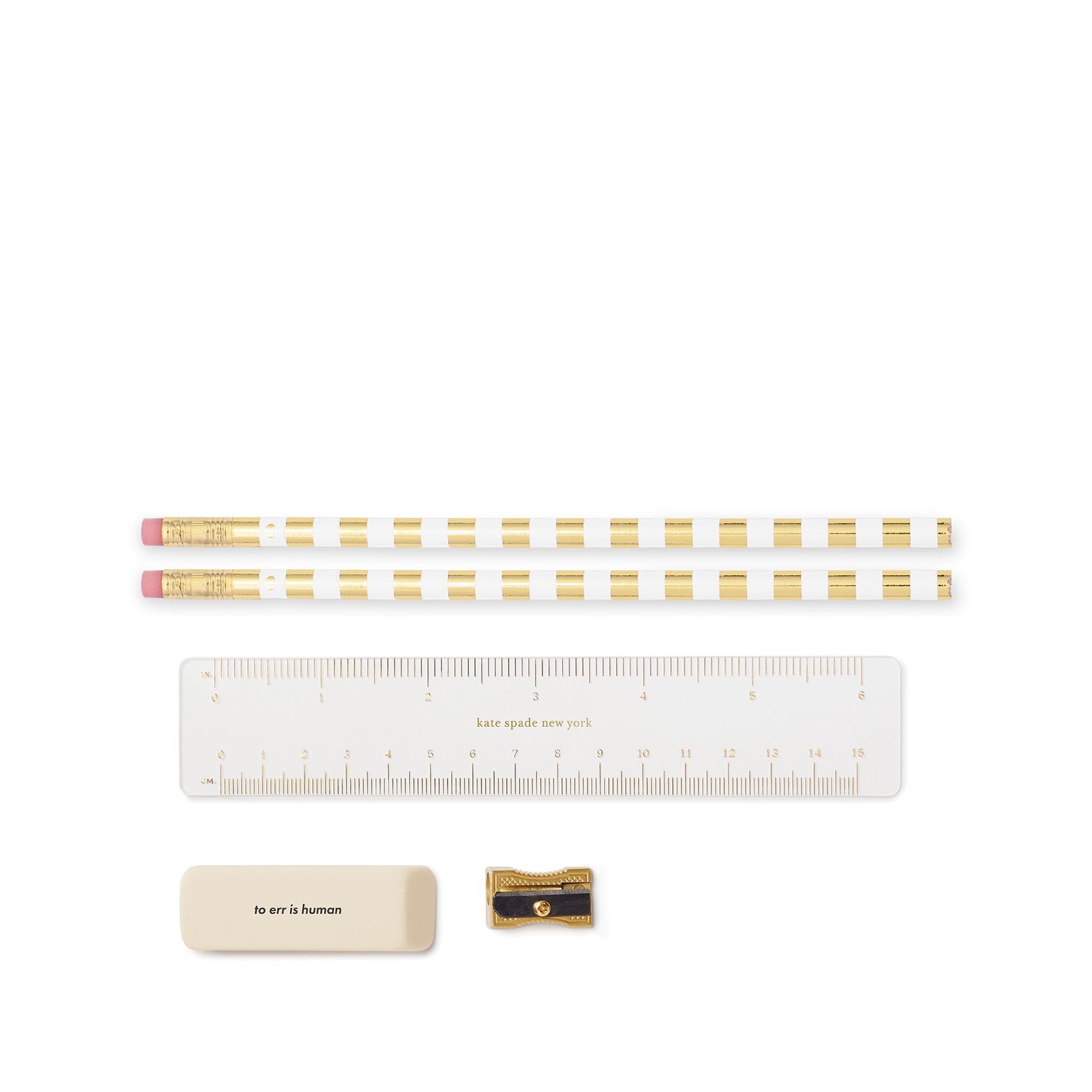 Set of pencils with gold stripes, a ruler, an eraser, and a sharpener on a white background