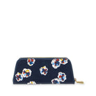 A navy blue velvet zip-around pouch with a gold zipper pull, decorated with a colorful floral pattern in red, blue, yellow, and white.