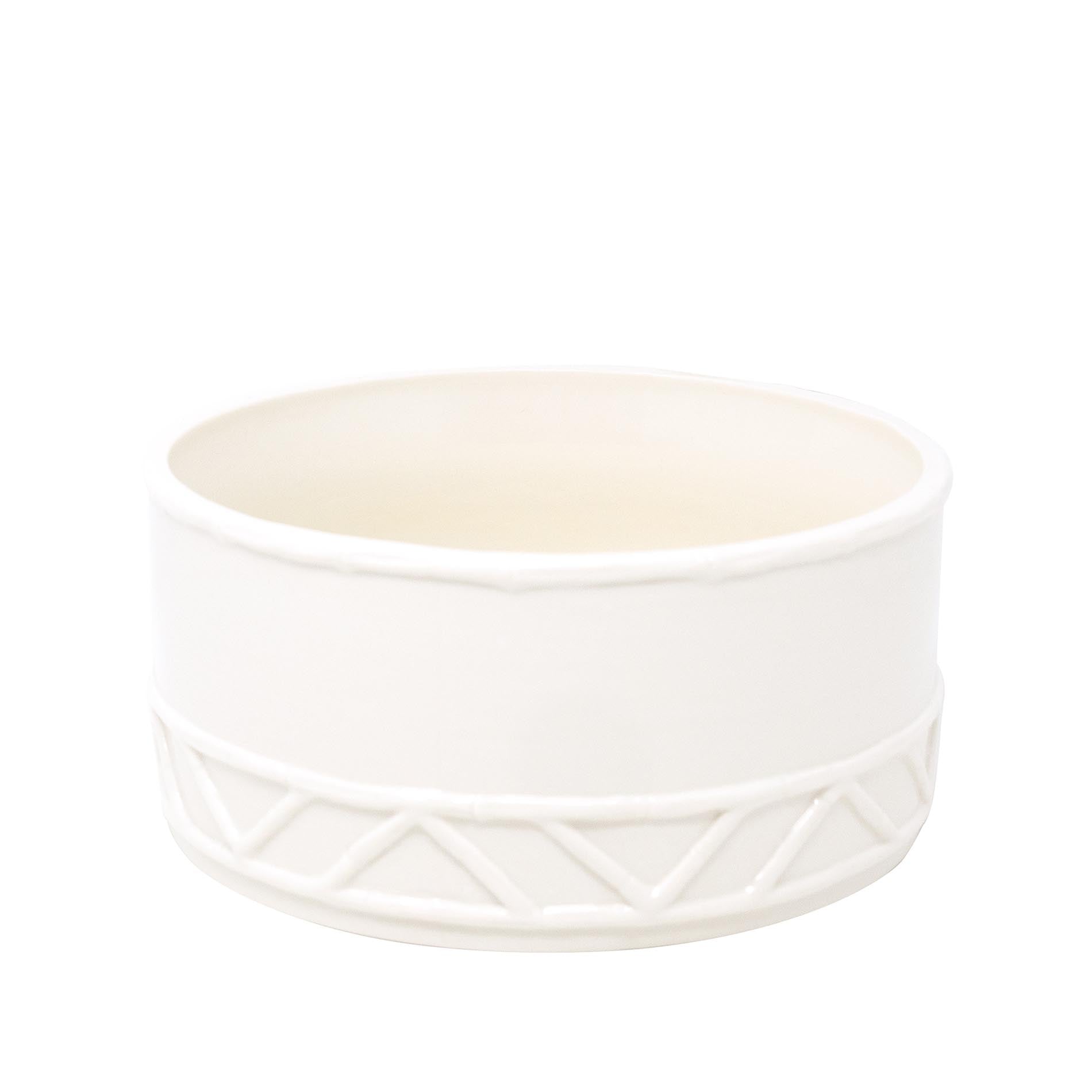 White ceramic bowl with geometric pattern on a white background