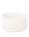 White ceramic bowl with geometric pattern on a white background