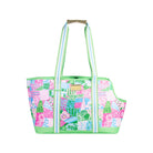 Colorful pet carrier with floral pattern on a white background