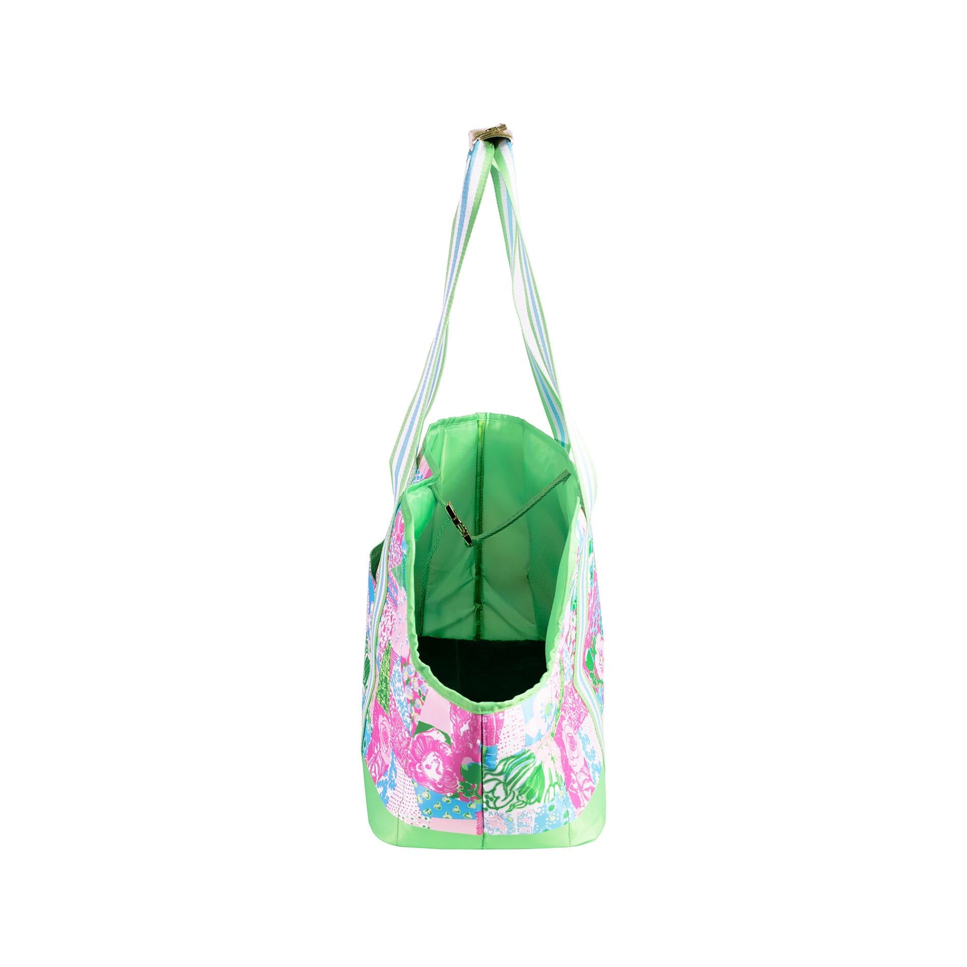 Floral-patterned pet carrier with a green interior on a white background