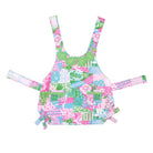 Colorful patchwork dress with floral and geometric patterns on a white background