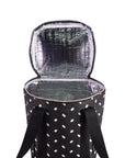 Black and white polka dot insulated cooler bag with open lid on a white background