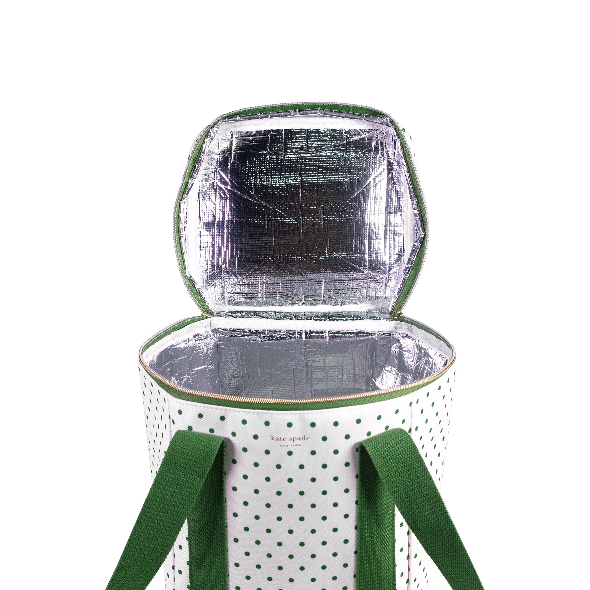 Insulated cooler bag with polka dot pattern and green handles on a white background