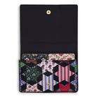 Multicolored geometric patterned cardholder with black border on a white background