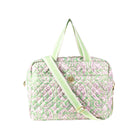 A quilted travel bag featuring a light green and pink paisley pattern, with matching green and white striped handles and a green adjustable shoulder strap, shown on a plain white background.