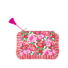 Floral pouch with red fringe and pink tassel on a white background