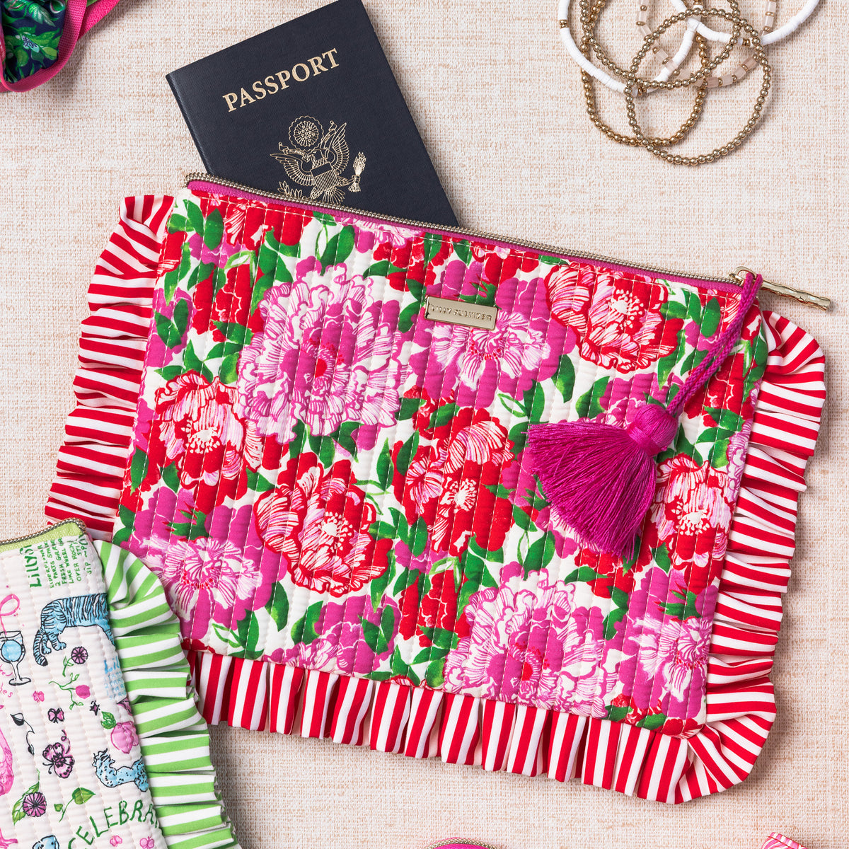 Floral pouch with red fringe and pink tassel  with a passport sticking out