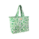A green and white tropical botanical print tote bag with ruffled trim and long shoulder straps, shown on a plain white background.
