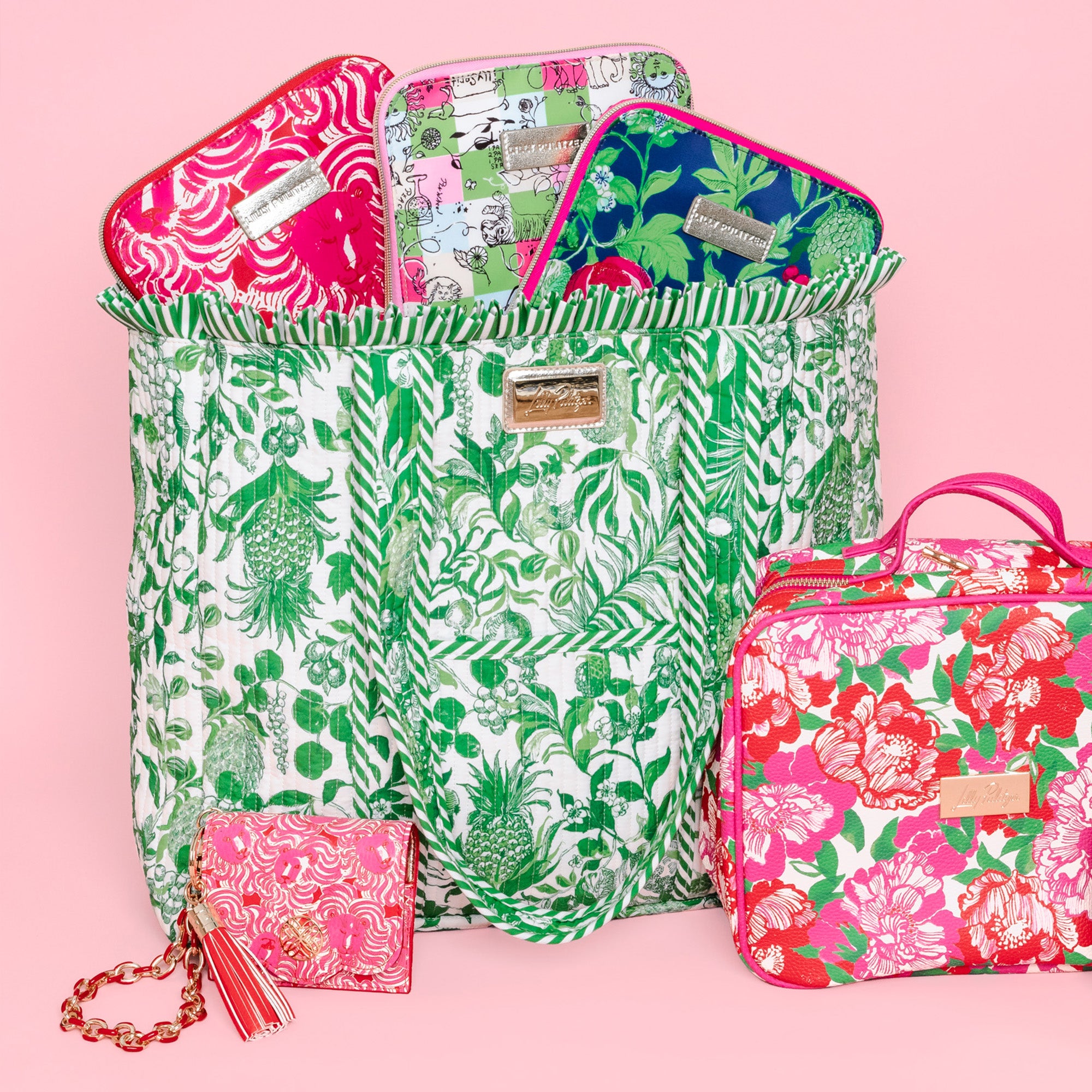 green and white tropical botanical print tote bag with ruffled trim and long shoulder straps filled with colorful LP items