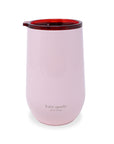 Pink tumbler with red interior on a white background, featuring 'kate spade New York' branding.
