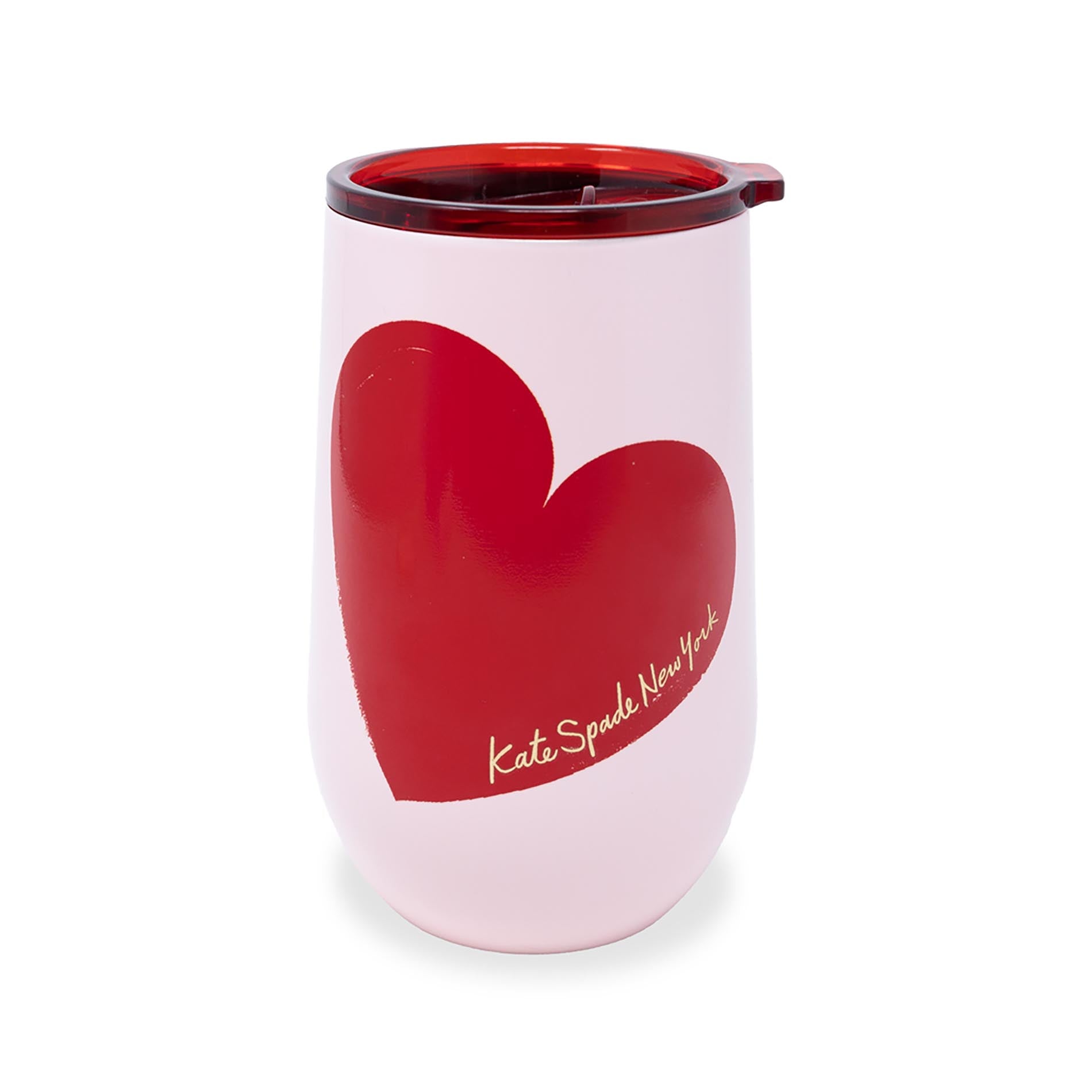Pink tumbler with a red heart and 'kate spade New York' logo on a white background