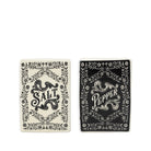 Two decorative rectangular items with ornate floral borders and central lettering, shown side by side on a white background. The left item reads "SALT" in black on an off-white background, and the right item reads "PEPPER" in white on a black background.