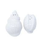 Two white shell-shaped salt and pepper shakers on a white background