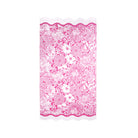 Pink floral beach towel with scalloped edge on a white background