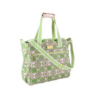 A green and pink patterned tote bag with a matching shoulder strap, gold-tone hardware, and a light beige leather top handle, shown on a plain white background.