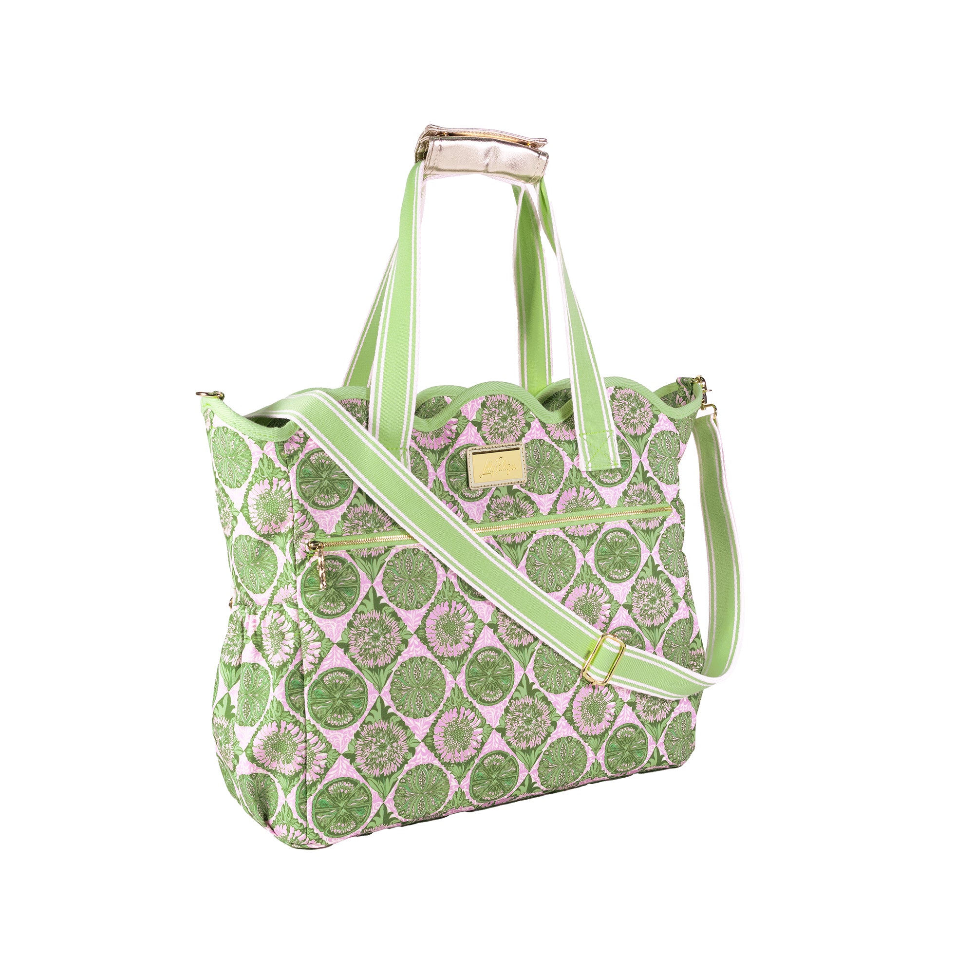 A green and pink patterned tote bag with a matching shoulder strap, gold-tone hardware, and a light beige leather top handle, shown on a plain white background.