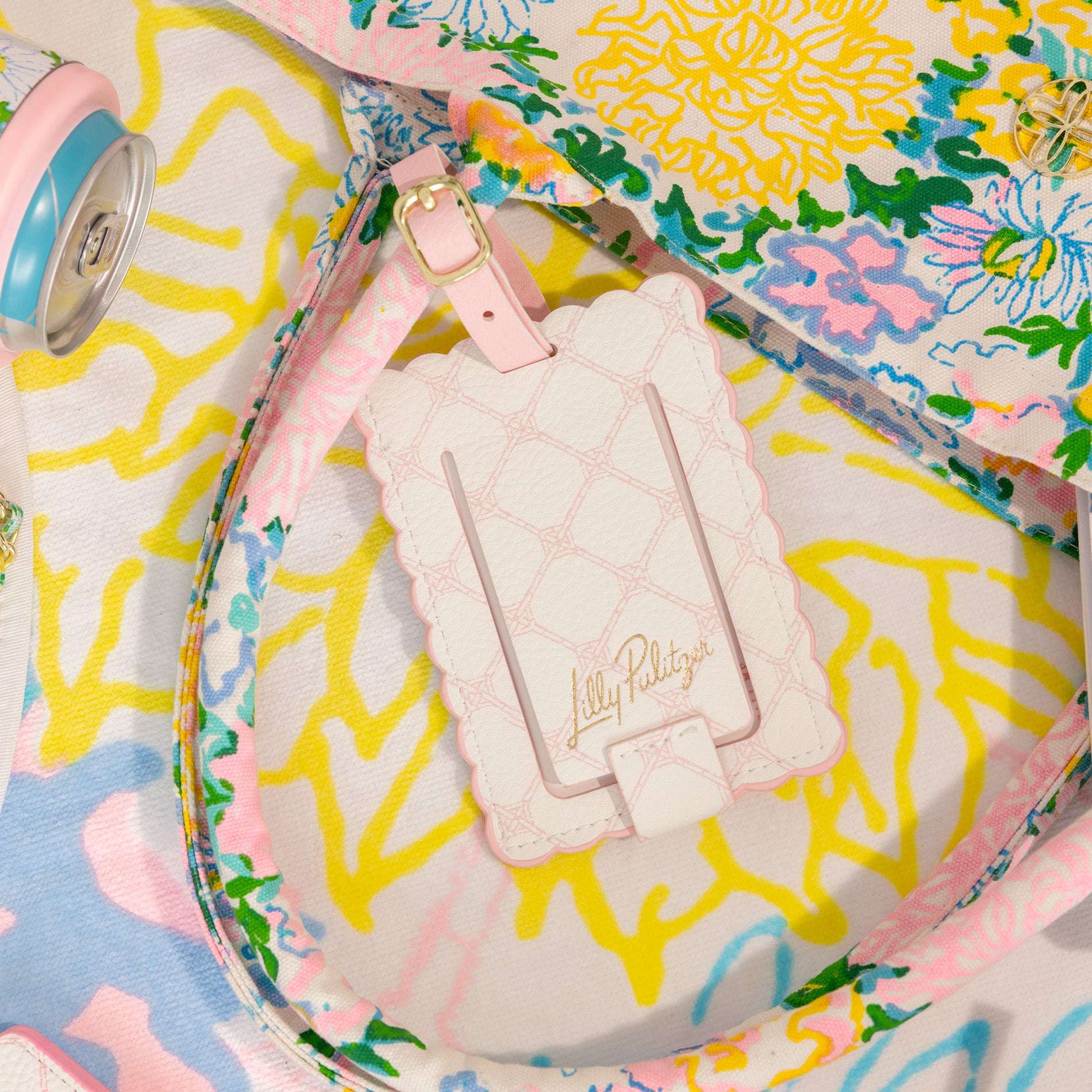 Lilly Pulitzer luggage tag on a colorful background