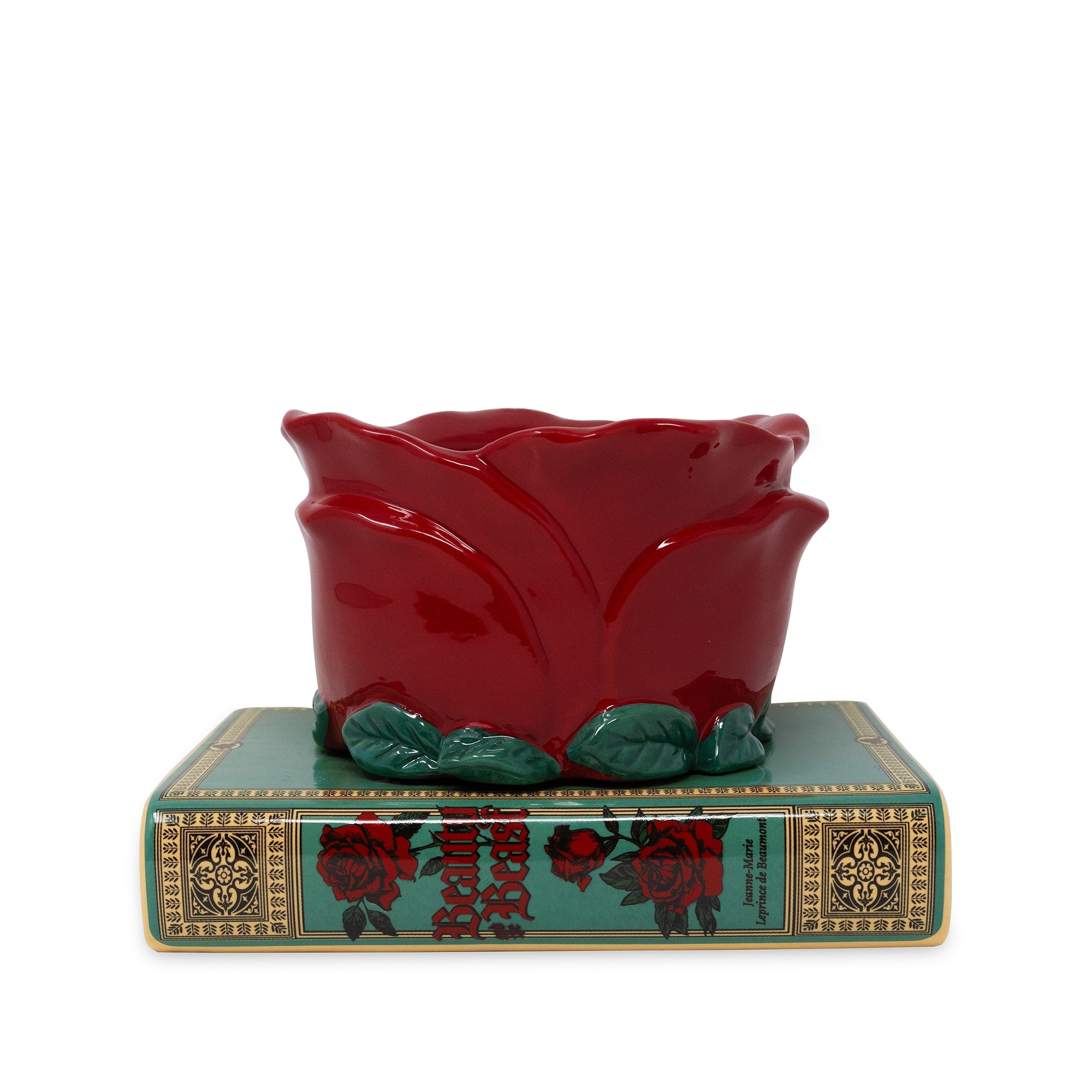 Red ceramic rose on a decorative base with rose design
