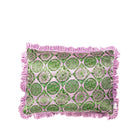 A decorative throw pillowcase with a pink and green botanical pattern and fringed edges, shown against a plain white background.