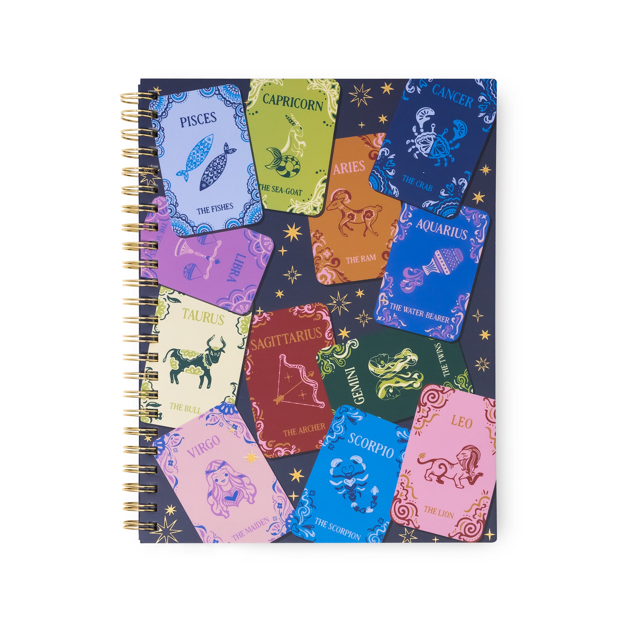 A spiral-bound notebook featuring a colorful collage of zodiac card designs on a dark navy background with gold stars. The cards represent different zodiac signs including Pisces, Capricorn, Aries, Aquarius, Taurus, Sagittarius, Leo, Scorpio, and Libra.