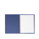 A blue spiral-bound notebook with lined white pages, shown open against a plain white background.