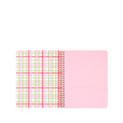 Notebook with pink and green plaid design on a white background