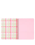 Notebook with pink and green plaid design on a white background