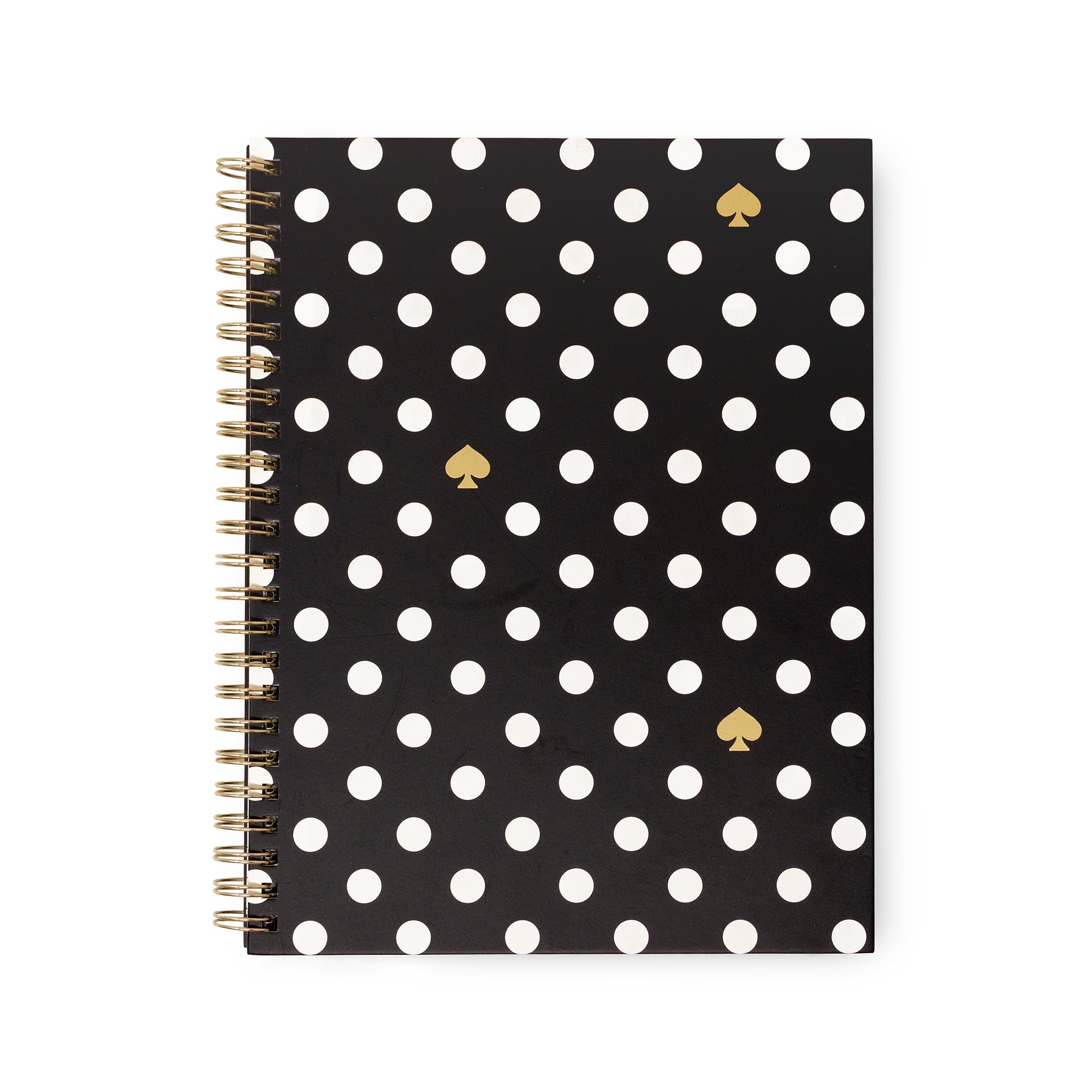 A spiral-bound notebook with a black cover decorated with white polka dots and three gold spade icons, shown on a plain white background.
