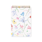 Notebook with colorful floral pattern on a white background