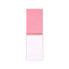 Pink notepad with lined pages on a white background