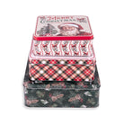 Three stacked square metal gift boxes with Christmas-themed designs, including a Santa Claus lid, a red-and-white patterned box, and a dark green box with a pinecone and berry print, on a white background.