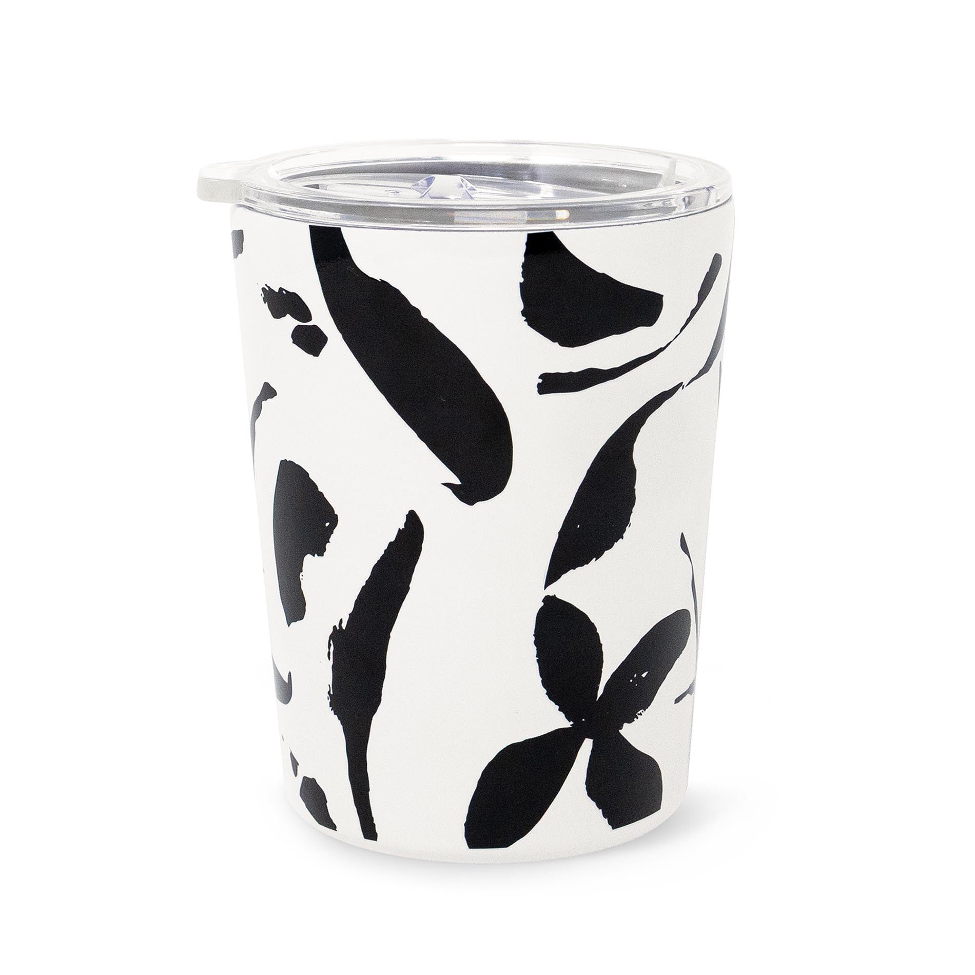 Tumbler with black abstract leaf pattern on a white background