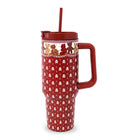 A red insulated travel tumbler with a handle, matching red lid and straw, decorated with bears