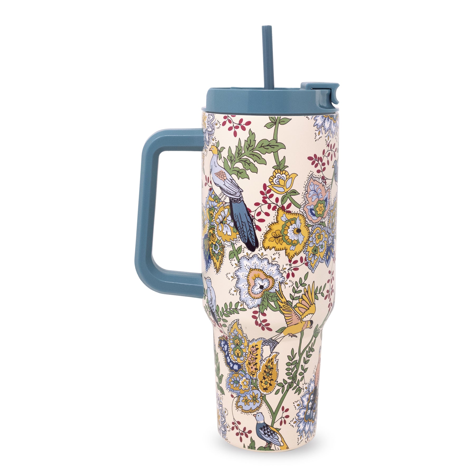 A tall insulated travel tumbler with a handle, featuring a detailed botanical and bird pattern on a light cream background, with a muted blue lid and straw.
