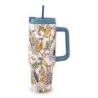 A tall insulated travel tumbler with a blue handle and lid, featuring a detailed bird and floral pattern on a light pink background, shown on a white background.