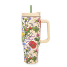Floral-patterned tumbler with a handle on a white background