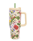 Floral-patterned tumbler with a handle on a white background