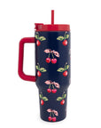 Navy blue tumbler with cherry pattern and red handle and lid on a white background