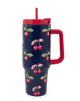 Navy blue tumbler with cherry pattern and red lid and handle on a white background