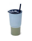 Tumbler with a blue and white striped design and a green base on a white background