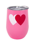 Pink tumbler with two heart designs on a white background